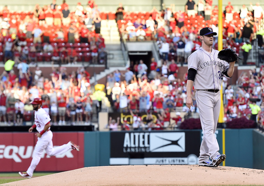 Jul 31, 2015; St. Louis, MO, USA; Colorado Rockies starting pitcher Kyle Kendrick (38) reacts after allowing a solo home run to St. Louis Cardinals third baseman Matt Carpenter (13) in the first inning at Busch Stadium. Mandatory Credit: Jasen Vinlove-USA TODAY Sports