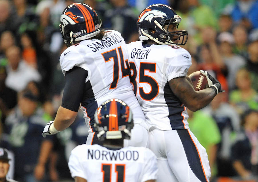 August 14, 2015; Seattle, WA, USA; Denver Broncos tight end Virgil Green (85) celebrates with offensive tackle Ty Sambrailo (74) after scoring a touchdown against the Seattle Seahawks during the first half in a preseason NFL football game at CenturyLink Field. Mandatory Credit: Gary A. Vasquez-USA TODAY Sports