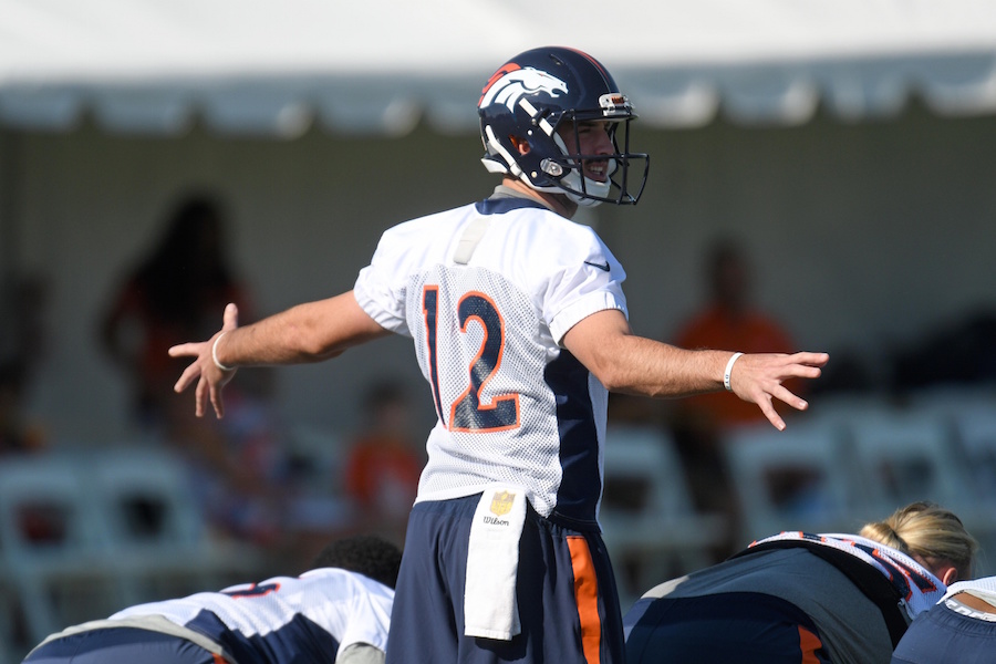 Jul 28, 2016; Englewood, CO, USA; Denver Broncos quarterback Paxton Lynch (12) calls out a play during training camp drills held at the UCHealth Training Center. Mandatory Credit: Ron Chenoy-USA TODAY Sports