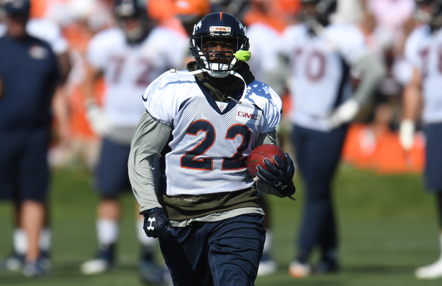 Jul 28, 2016; Englewood, CO, USA; Denver Broncos running back C.J. Anderson (22) carries the ball during training camp drills held at the UCHealth Training Center. Mandatory Credit: Ron Chenoy-USA TODAY Sports