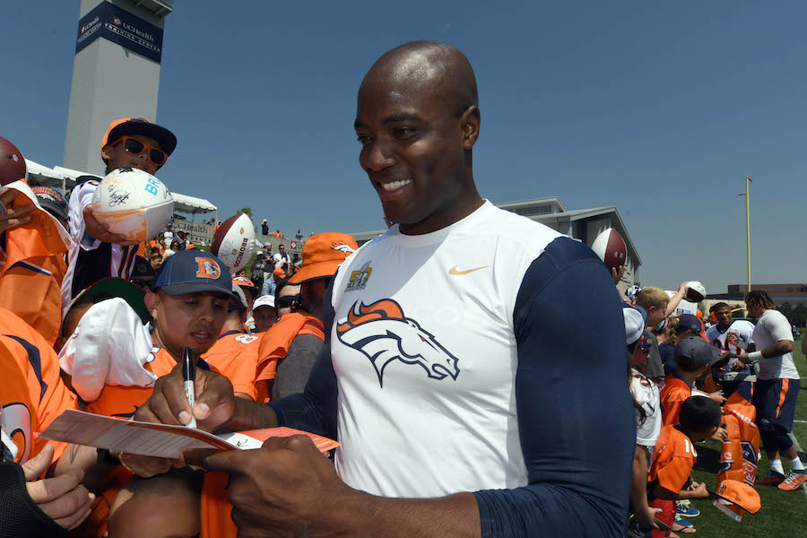 Jul 28, 2016; Englewood, CO, USA; Denver Broncos outside linebacker DeMarcus Ware (94) signs autographs following training camp drills held at the UCHealth Training Center. Mandatory Credit: Ron Chenoy-USA TODAY Sports