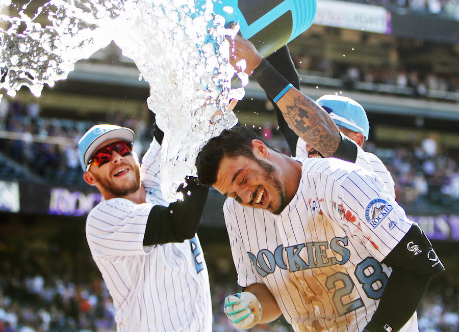 Colorado Rockies third baseman Nolan Arenado hugs his mom, Millie