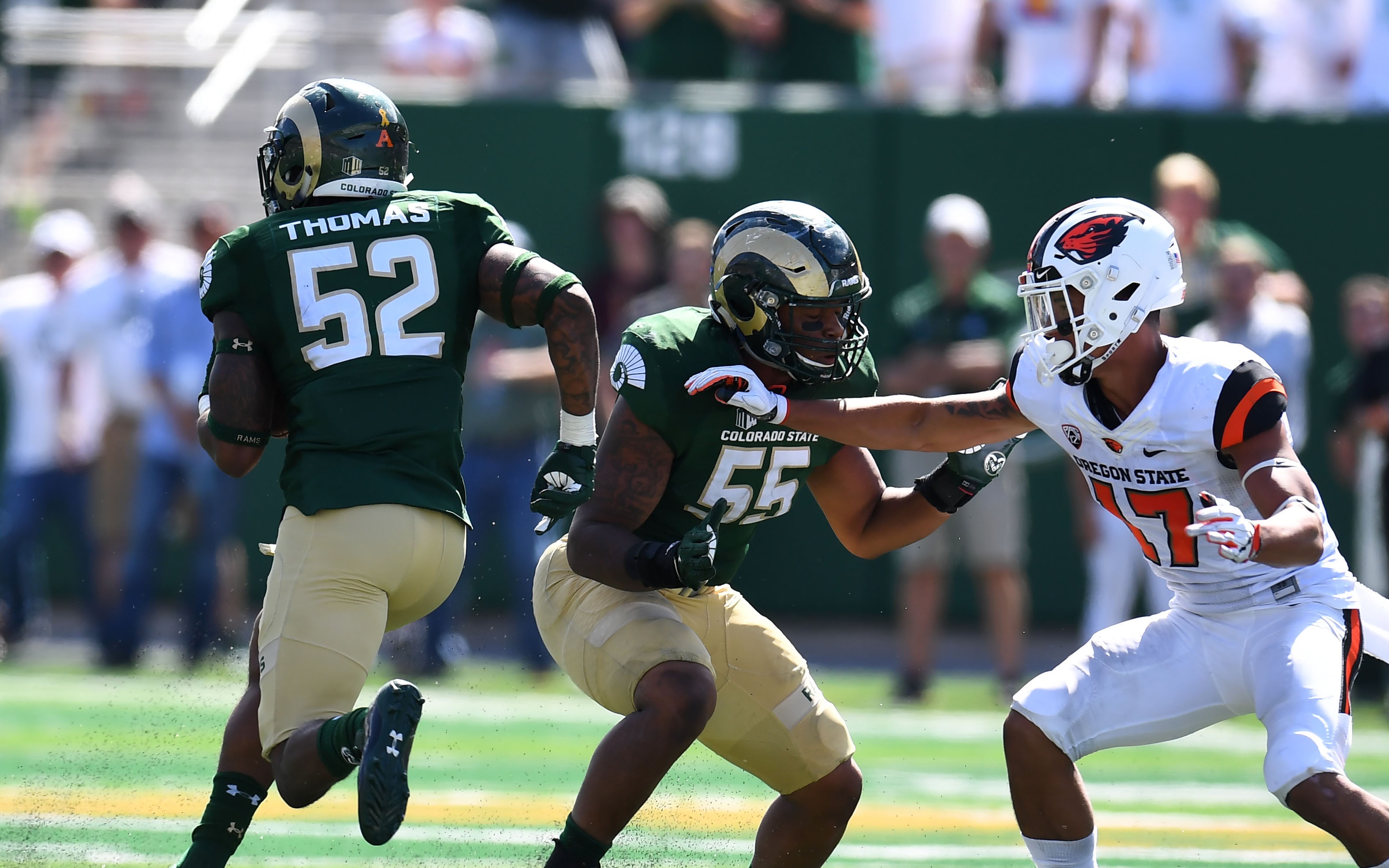 Aug 26, 2017; Fort Collins, CO, USA; Colorado State Rams linebacker Tre Thomas (52) linebacker Josh Watson (55) blocks on Oregon State Beavers wide receiver Isaiah Hodgins (17) in the third quarter at Sonny Lubrick Field at Colorado State Stadium. Mandatory Credit: Ron Chenoy-USA TODAY Sports