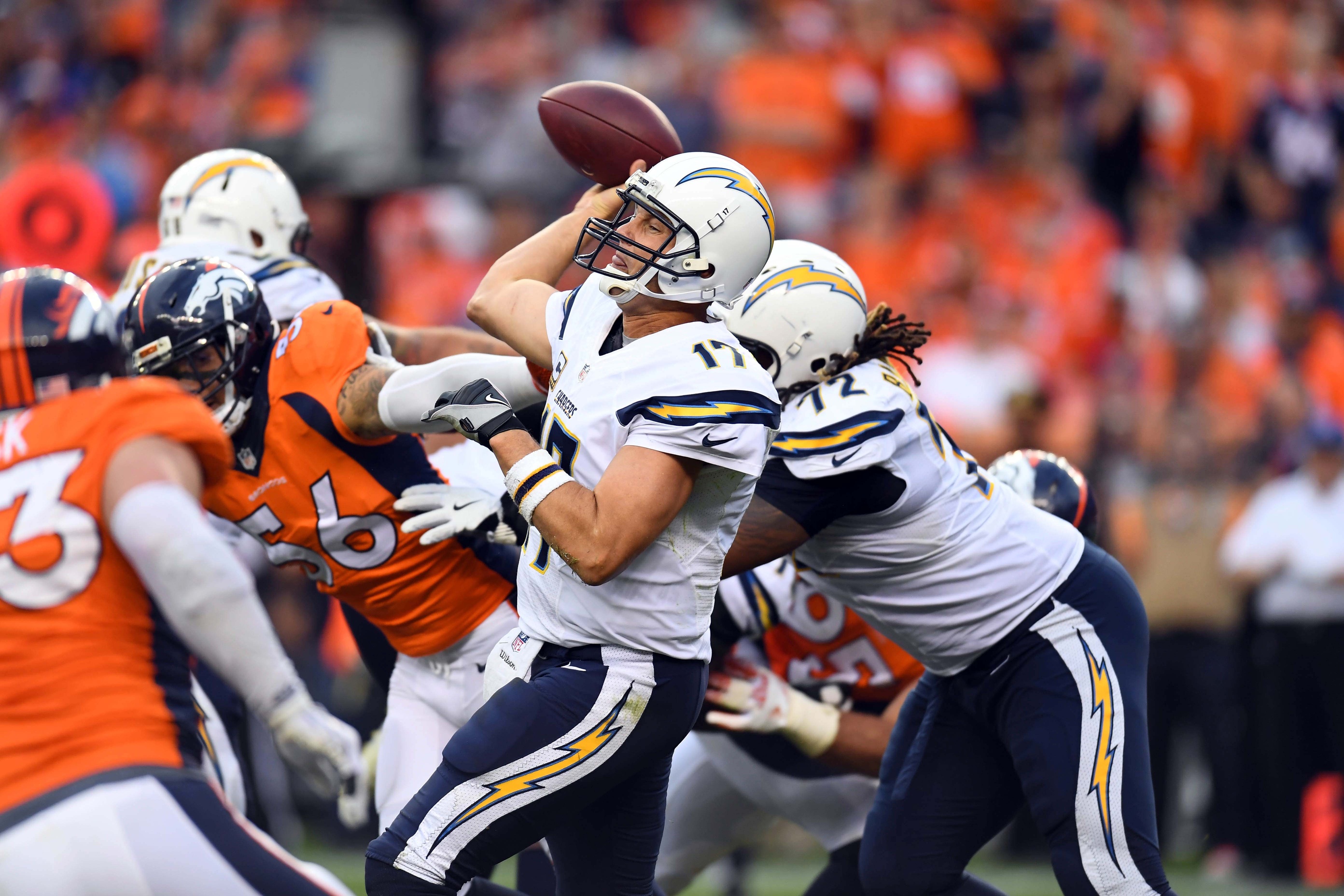 Oct 30, 2016; Denver, CO, USA; San Diego Chargers quarterback Philip Rivers (17) attempts a fourth down pass in the fourth quarter against the Denver Broncos at Sports Authority Field at Mile High. The Broncos defeated the Chargers 27-19. Mandatory Credit: Ron Chenoy-USA TODAY Sports