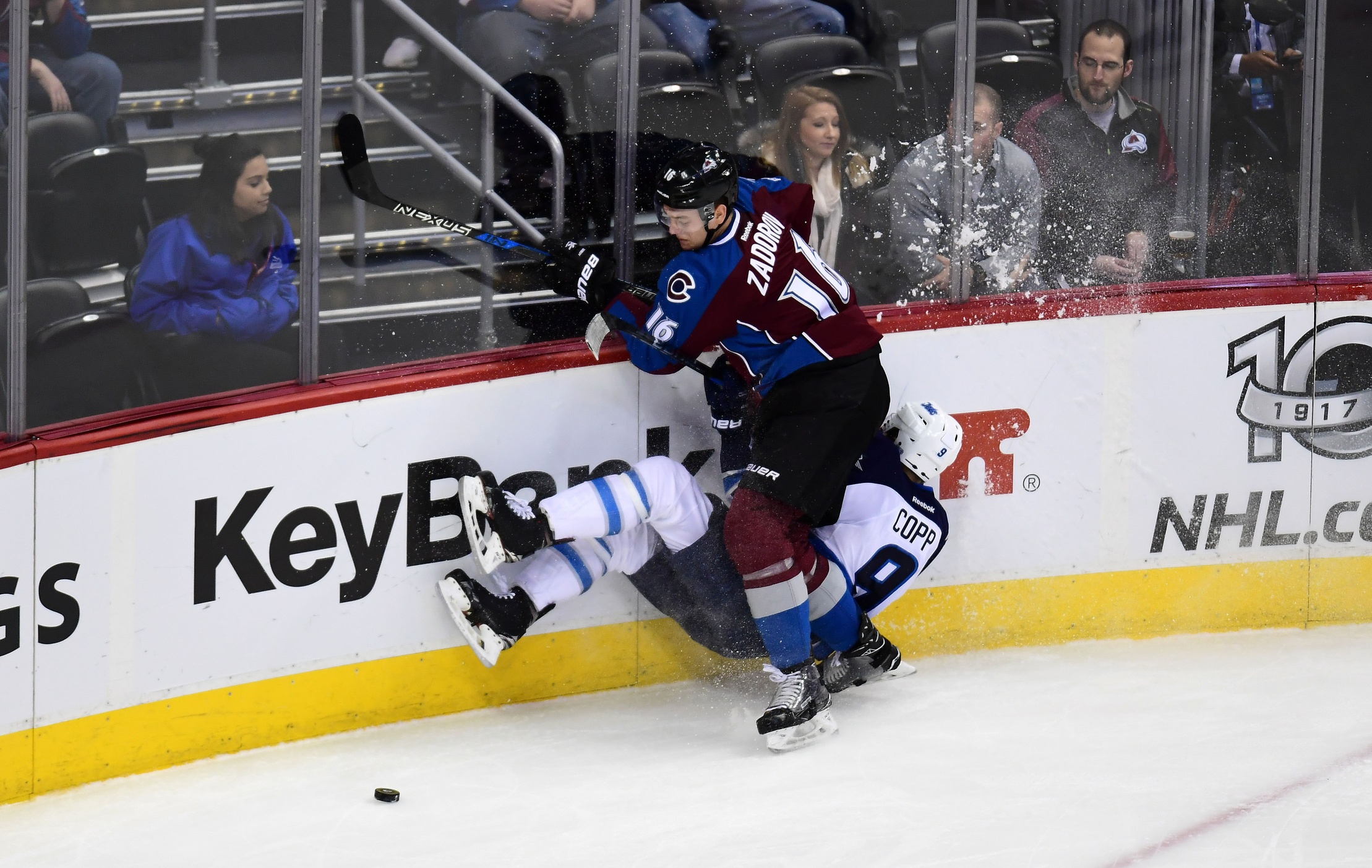 Feb 4, 2017; Denver, CO, USA; Winnipeg Jets center Andrew Copp (9) is checked by Colorado Avalanche defenseman Nikita Zadorov (16) in the second period at the Pepsi Center. Mandatory Credit: Ron Chenoy-USA TODAY Sports