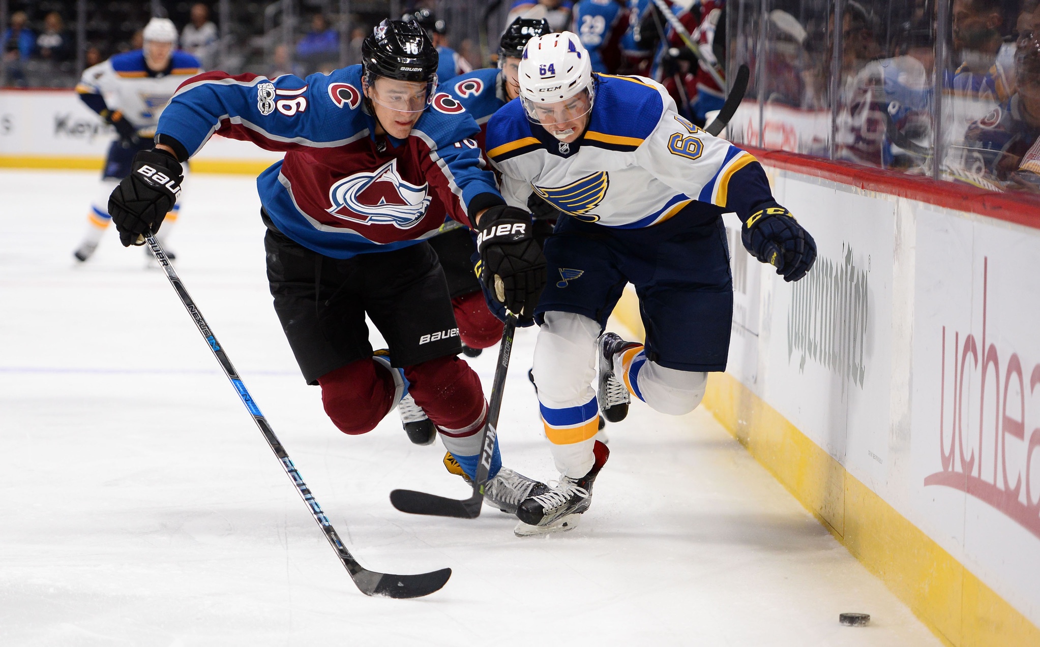 Oct 19, 2017; Denver, CO, USA; St. Louis Blues left wing Sammy Blais (64) and Colorado Avalanche defenseman Nikita Zadorov (16) battle for control of the puck in the first period at the Pepsi Center. Mandatory Credit: Ron Chenoy-USA TODAY Sports USATSI_10356505_164063748_lowres