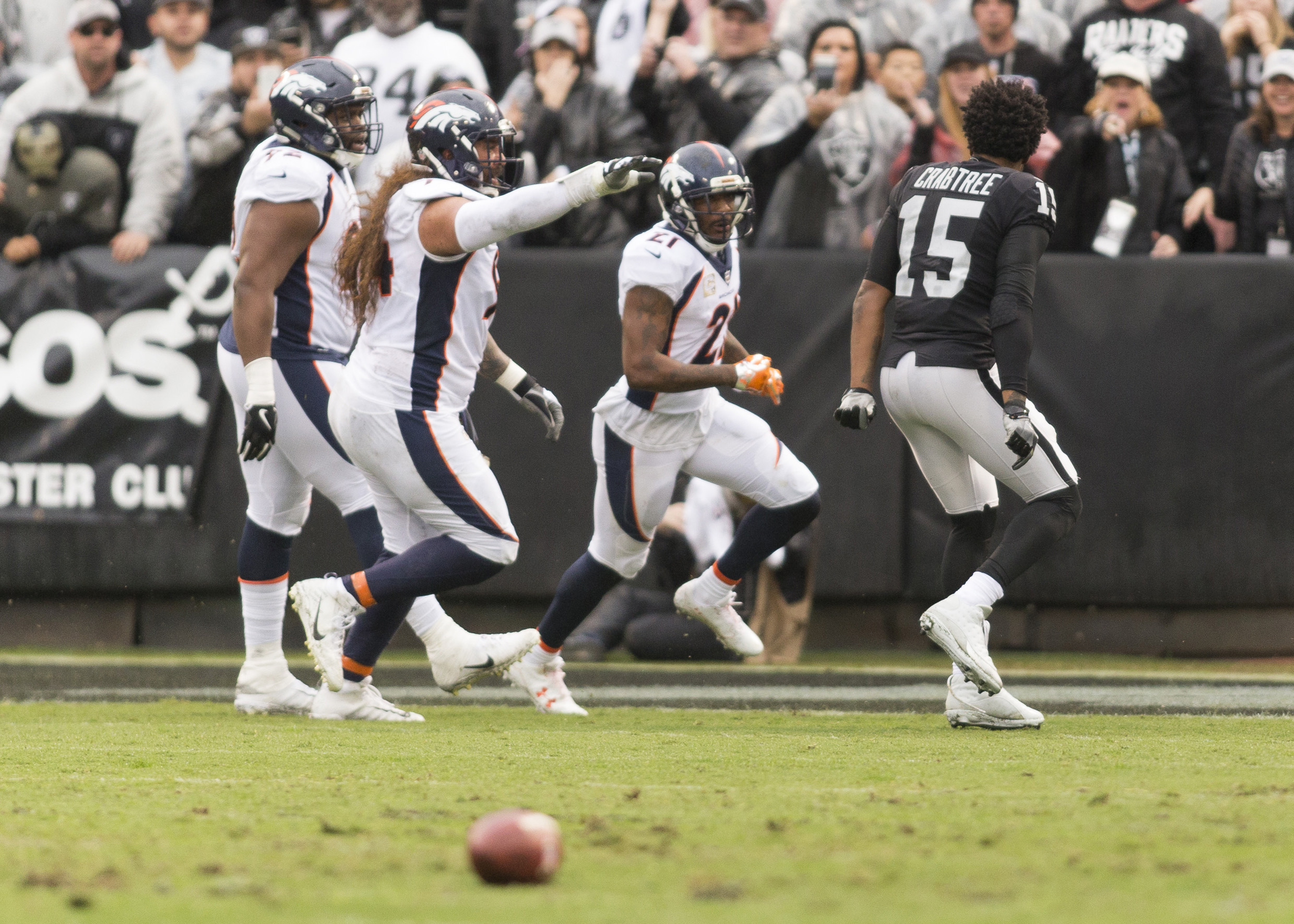 Oakland Raiders wide receiver Michael Crabtree (15) taunts Denver Broncos cornerback Aqib Talib (21) after the incident on the sidelines during the first quarter at Oakland Coliseum.