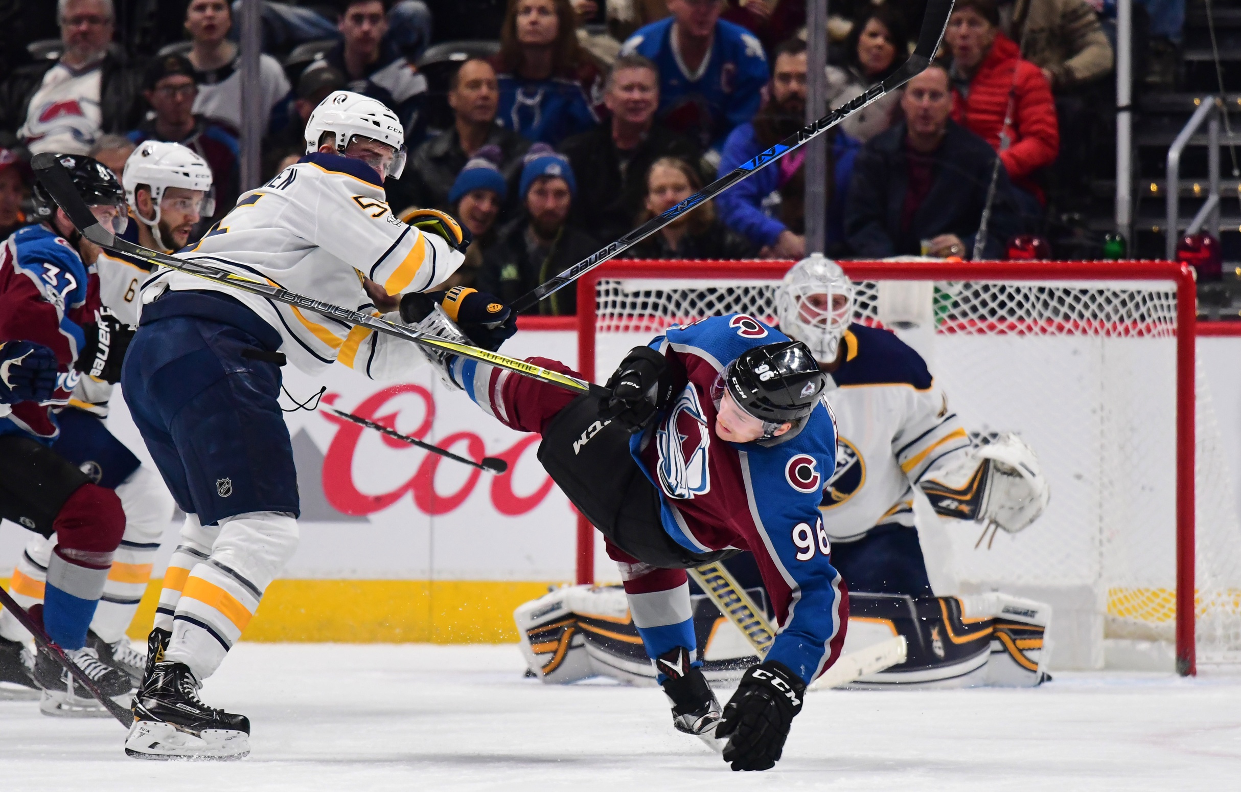 Buffalo Sabres defenseman Rasmus Ristolainen (55) hits Colorado Avalanche right wing Mikko Rantanen (96) into the ice in the first period at the Pepsi Center. Mandatory Credit: Ron Chenoy-USA TODAY Sports