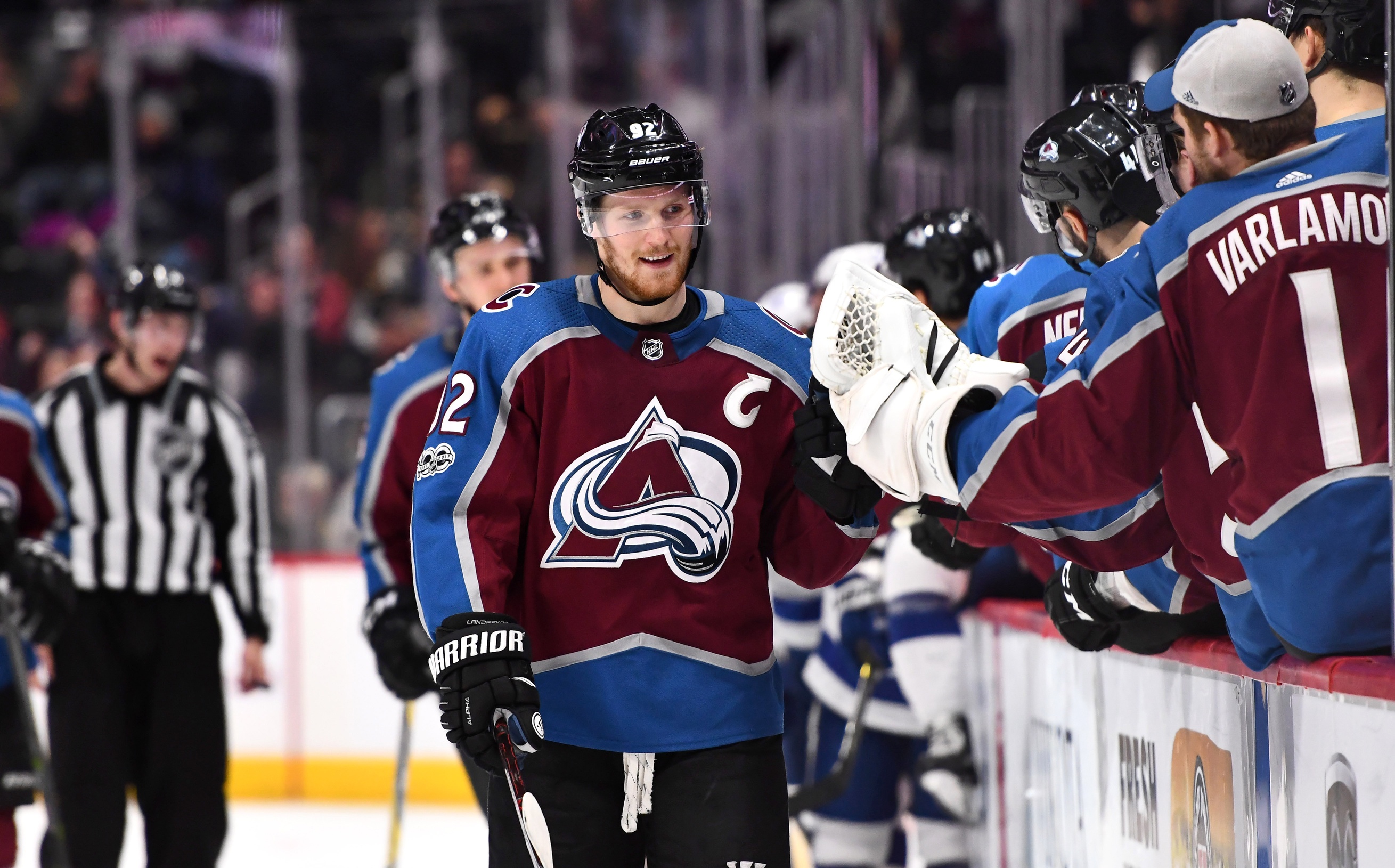 Gabe Landeskog celebrates his third goal at the bench as the hats fly onto the ice Saturday night. Credit: Ron Chenoy-USA TODAY Sports