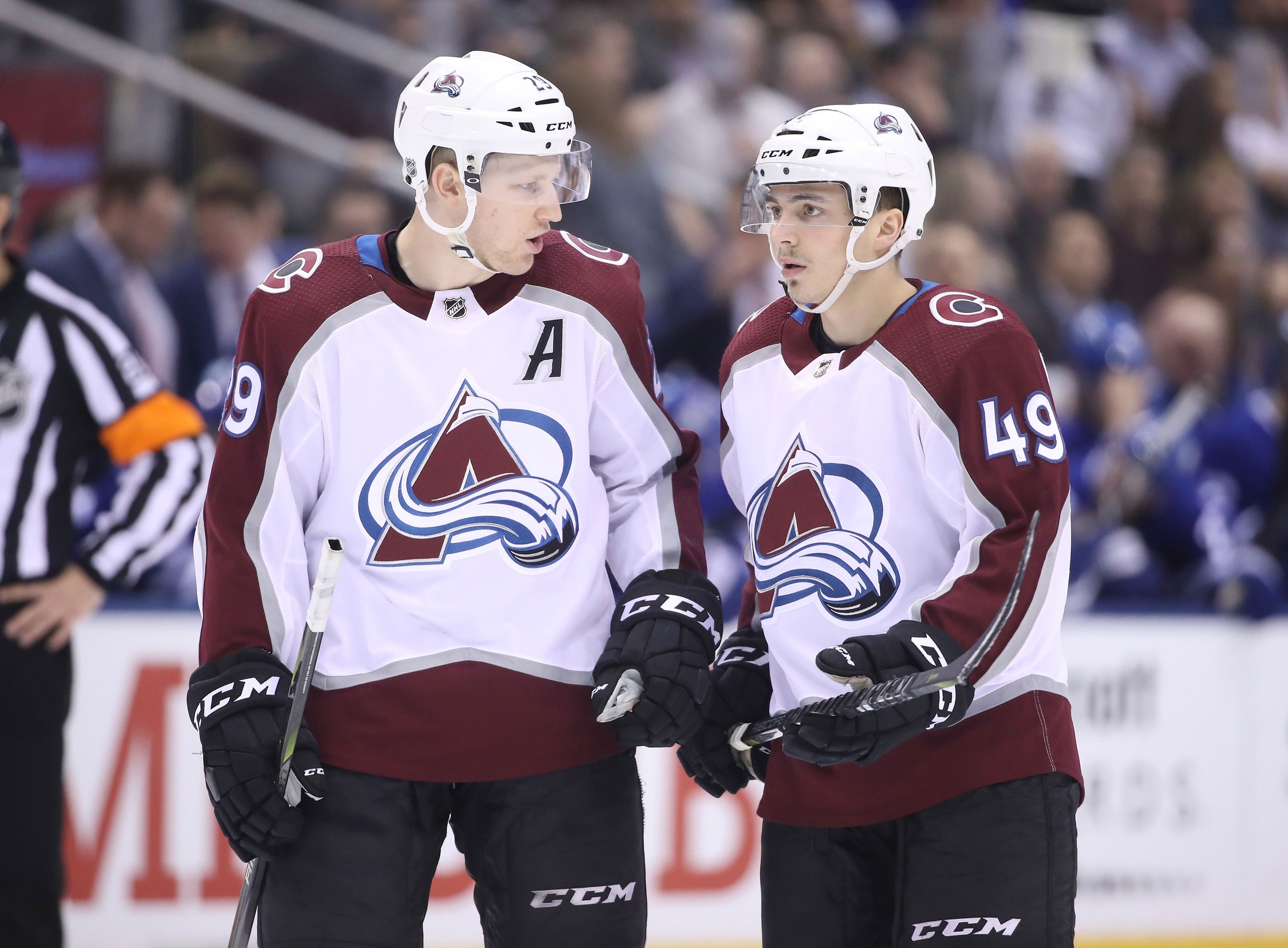 Jan 22, 2018; Toronto, Ontario, CAN; Colorado Avalanche center Nathan MacKinnon (29) talks to defenseman Samuel Girard (49) during their game against the Toronto Maple Leafs at Air Canada Centre. The Avalanche beat the Maple Leafs 4-2. Mandatory Credit: Tom Szczerbowski-USA TODAY Sports