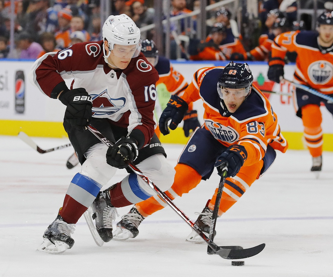 Feb 1, 2018; Edmonton, Alberta, CAN; Edmonton Oilers defensemen Matt Benning (83) defends Colorado Avalanche defensemen Nikita Zadorov (16) during the second period at Rogers Place. Mandatory Credit: Perry Nelson-USA TODAY Sports