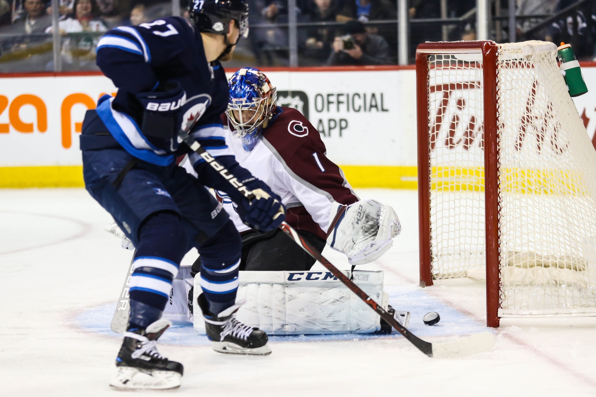 Feb 3, 2018; Winnipeg, Manitoba, CAN; Colorado Avalanche goalie Semyon Varlamov (1) stops Winnipeg Jets forward Nikolaj Ehlers (27) during the second period at Bell MTS Centre. Mandatory Credit: Terrence Lee-USA TODAY Sports