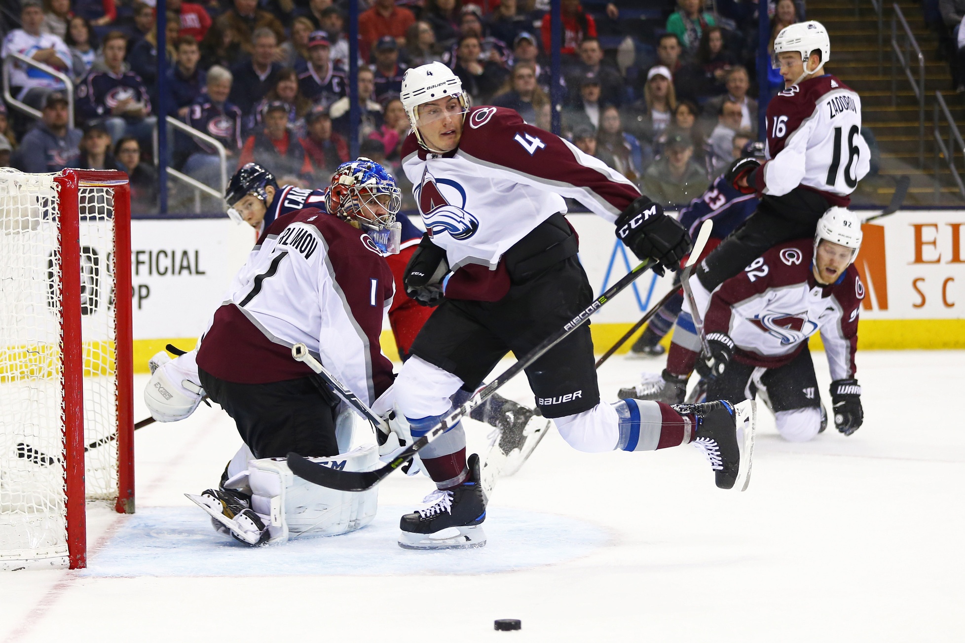 Mar 8, 2018; Columbus, OH, USA; Colorado Avalanche defenseman Tyson Barrie (4) attempts to clear the puck away from goaltender Semyon Varlamov (1) against the Columbus Blue Jackets in the second period at Nationwide Arena. Mandatory Credit: Aaron Doster-USA TODAY Sports