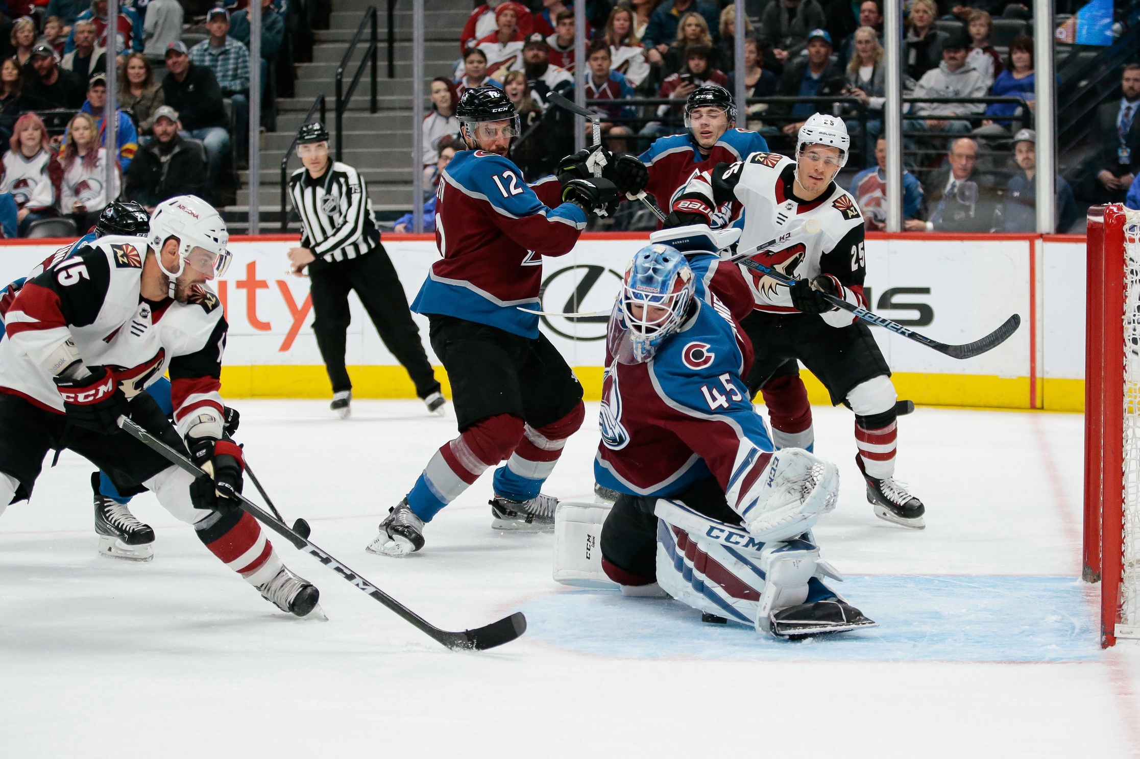 Mar 10, 2018; Denver, CO, USA; Colorado Avalanche goaltender Jonathan Bernier (45) makes a save on a shot from Arizona Coyotes center Brad Richardson (15) as defenseman Patrik Nemeth (12) defends against center Nick Cousins (25) in the first period at the Pepsi Center. Mandatory Credit: Isaiah J. Downing-USA TODAY Sports
