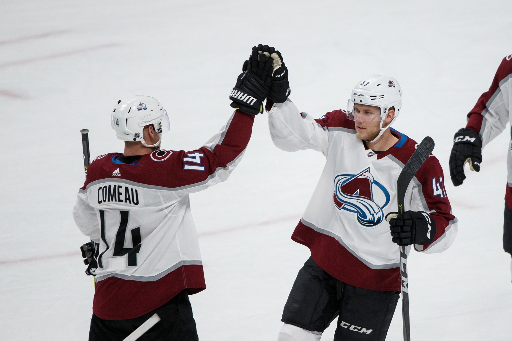 Mar 13, 2018; Saint Paul, MN, USA; Colorado Avalanche forward Dominic Toninato (47) high fives Colorado Avalanche forward Blake Comeau (14) after the game against Minnesota Wild at Xcel Energy Center. Mandatory Credit: Brad Rempel-USA TODAY Sports