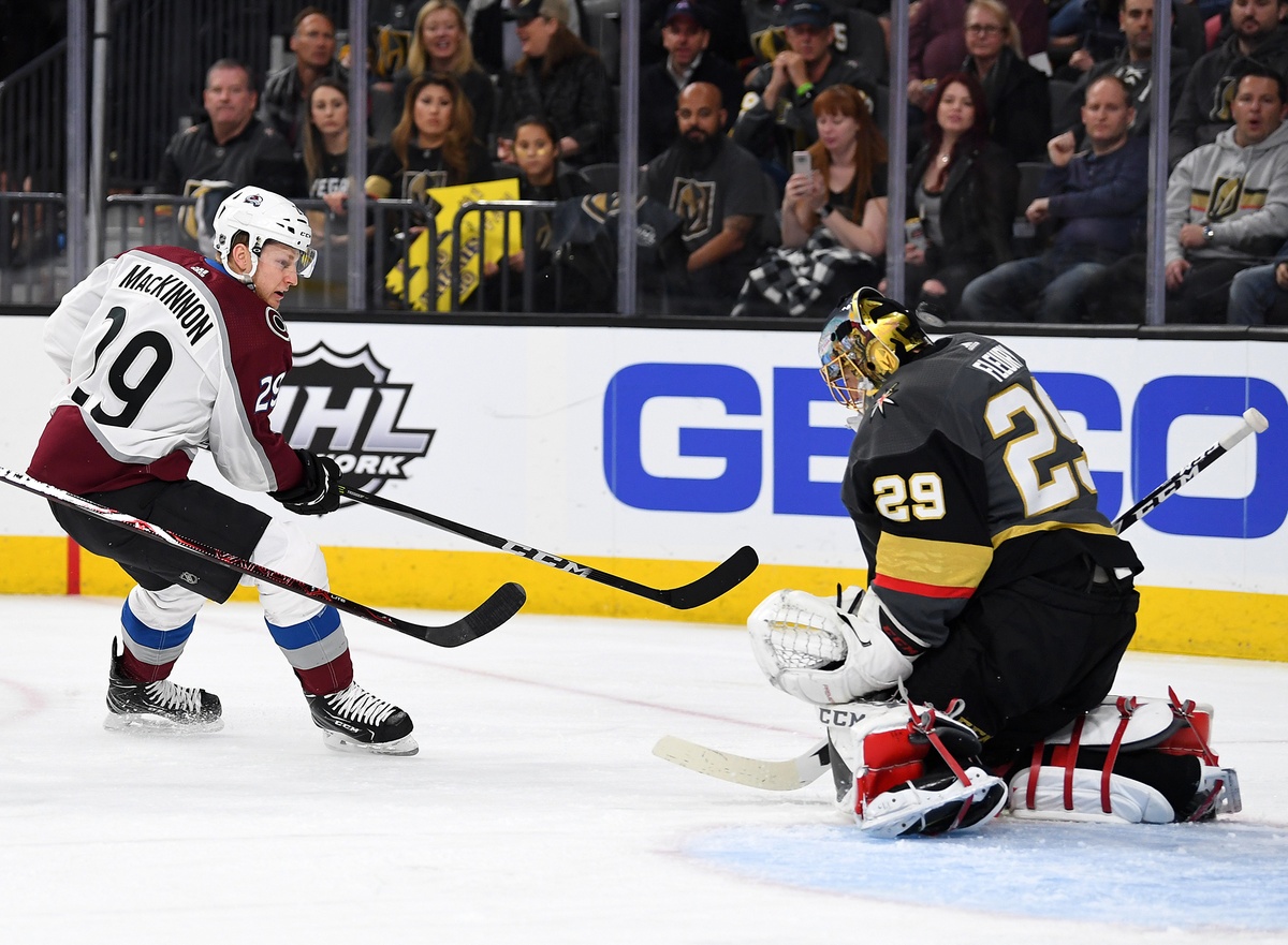Mar 26, 2018; Las Vegas, NV, USA; Colorado Avalanche center Nathan MacKinnon (29) attempts a shot on Vegas Golden Knights goaltender Marc-Andre Fleury (29) during the first period at T-Mobile Arena. Mandatory Credit: Stephen R. Sylvanie-USA TODAY Sports