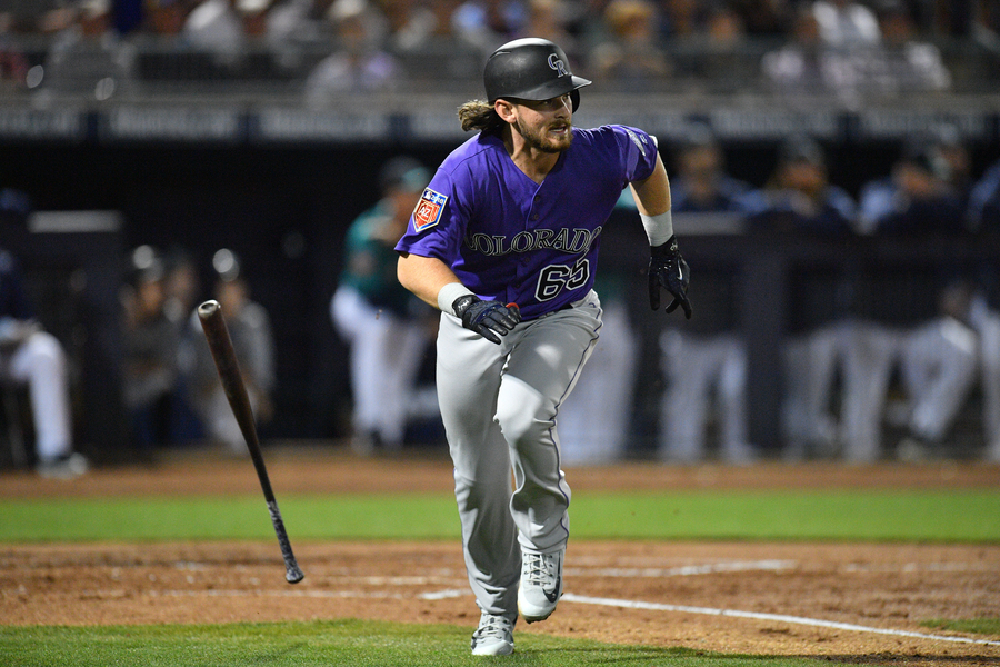 MLB: Spring Training-Colorado Rockies at Seattle Mariners Mar 6, 2018; Peoria, AZ, USA; Colorado Rockies shortstop Brendan Rodgers (65) runs after hitting a pitch against the Seattle Mariners during the second inning at Peoria Sports Complex. Mandatory Credit: Joe Camporeale-USA TODAY Sports