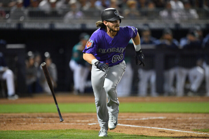 Mar 6, 2018; Peoria, AZ, USA; Colorado Rockies shortstop Brendan Rodgers (65) runs after hitting a pitch against the Seattle Mariners during the second inning at Peoria Sports Complex. Mandatory Credit: Joe Camporeale-USA TODAY Sports