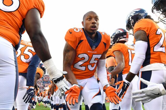 Chris Harris Jr. gets low fives from teammates pre-game. Credit: Ron Chenoy, USA TODAY Sports.