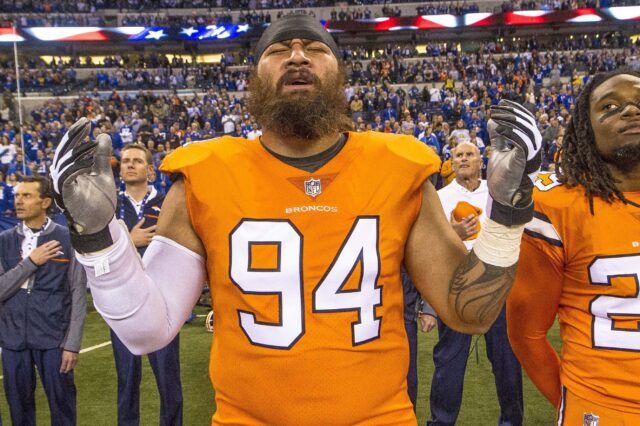 Domata Peko sings the National Anthem on the sideline before a game in 2017. Credit: Thomas J. Russo, USA TODAY Sports.