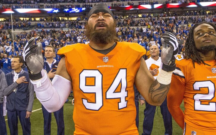 Domata Peko sings the National Anthem on the sideline before a game in 2017. Credit: Thomas J. Russo, USA TODAY Sports.