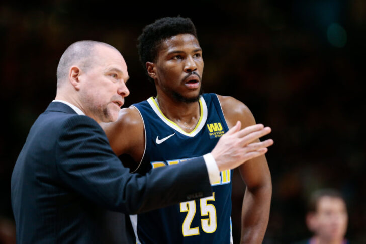 Denver Nuggets head coach Michael Malone talks with guard Malik Beasley (25) in the second quarter against the Memphis Grizzlies at the Pepsi Center.