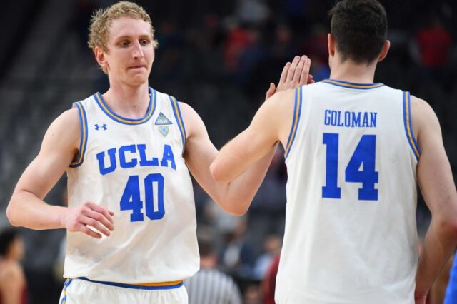 UCLA Bruins center Thomas Welsh (40) celebrates with UCLA Bruins forward Gyorgy Goloman (14) after the Bruins defeated the Stanford Cardinal in a quarterfinal match of the Pac-12 Tournament at T-Mobile Arena.