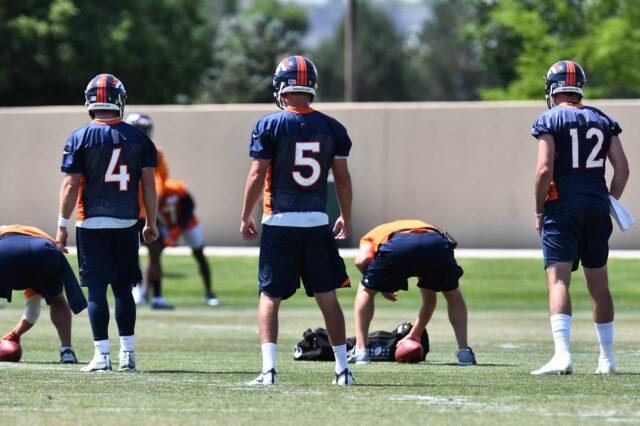 Case Keenum (4) and Paxton Lynch (12) take snaps at Broncos OTAs. Credit: Ron Chenoy, USA TODAY Sports.