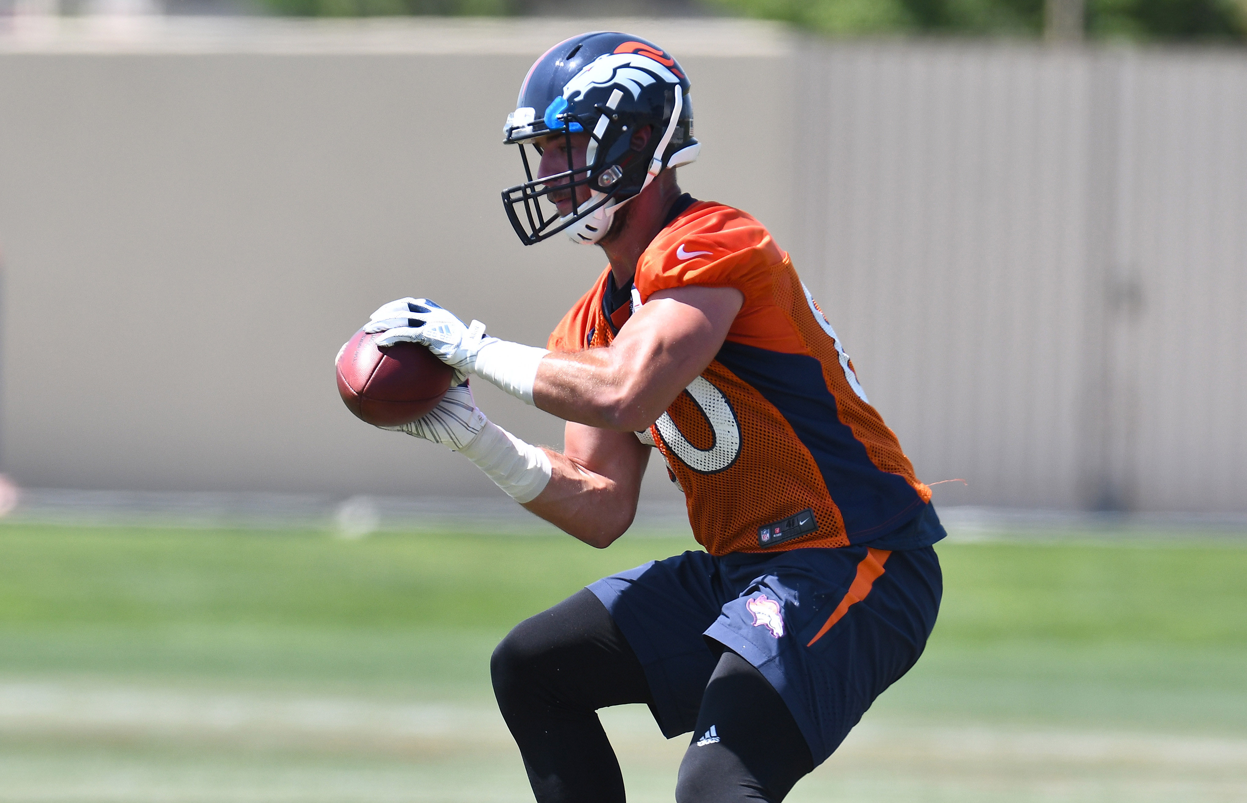 Denver Broncos tight end Jake Butt (80) takes part in drills