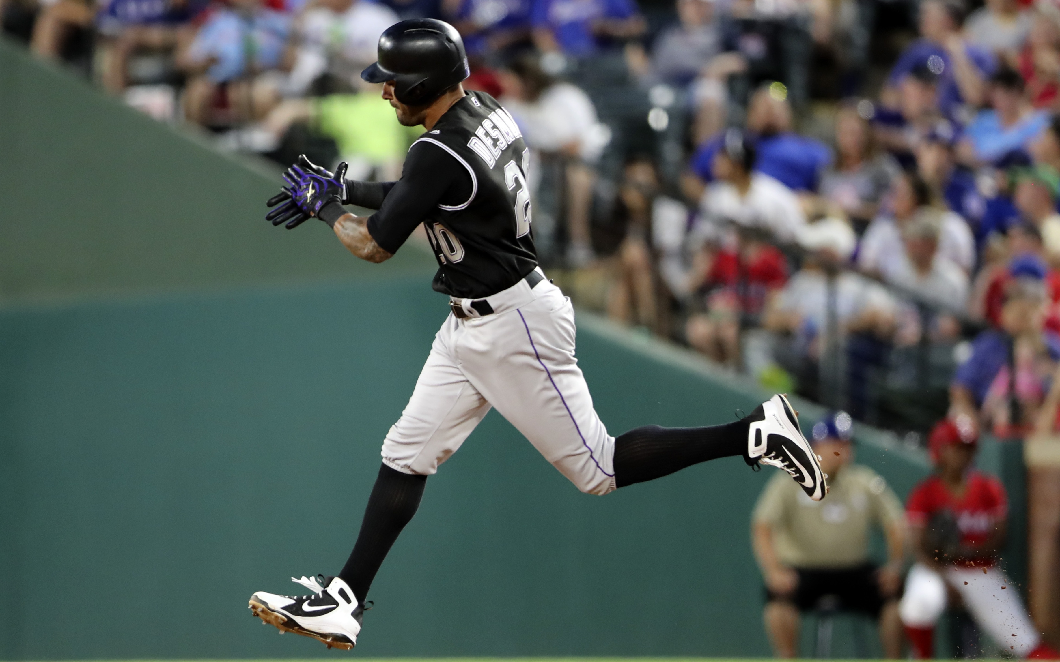 USATSI_10895967 Cropped Ian Desmond trots around the bases after a home run against Texas on June 15. Credit: Kevin Jairaj, USA TODAY Sports.