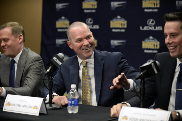 Denver Nuggets head coach Michael Malone (center), general manager GM Tim Connelly (left) and president Josh Kroenke (right) react to a media question during a press conference at the Pepsi Center