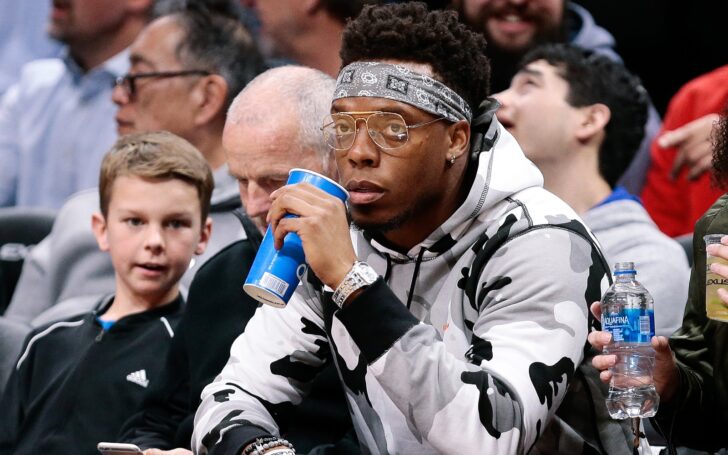 Brandon Marshall, courtside at a Nuggets game. Credit: Ron Chenoy, USA TODAY Sports.