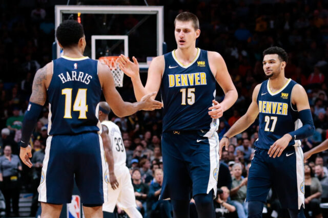 Denver Nuggets guard Gary Harris (14) and center Nikola Jokic (15) and guard Jamal Murray (27) in the third quarter against the New Orleans Pelicans at the Pepsi Center