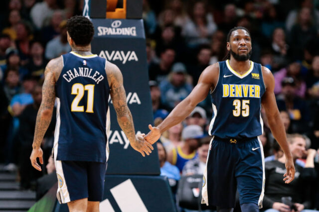 Denver Nuggets forward Wilson Chandler (21) and forward Kenneth Faried (35) in the third quarter against the Memphis Grizzlies at the Pepsi Center.