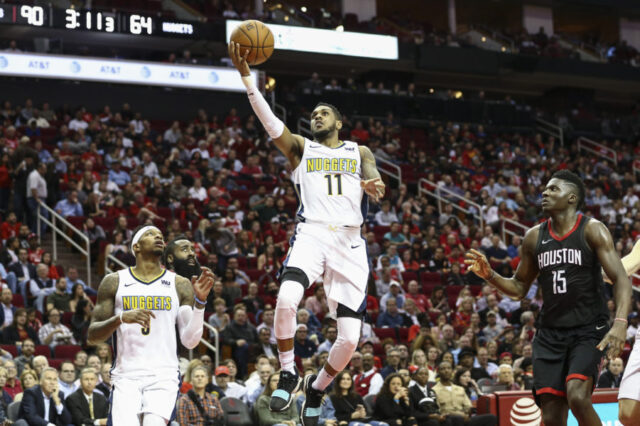 Denver Nuggets guard Monte Morris (11) shoots the ball during the third quarter against the Houston Rockets at Toyota Center.