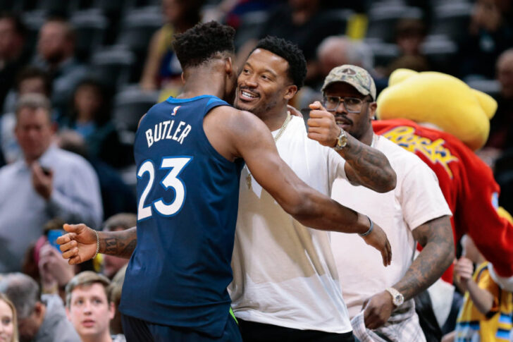 Minnesota Timberwolves guard Jimmy Butler (23) greets Denver Broncos player Demaryius Thomas before the game against the Denver Nuggets at the Pepsi Center.