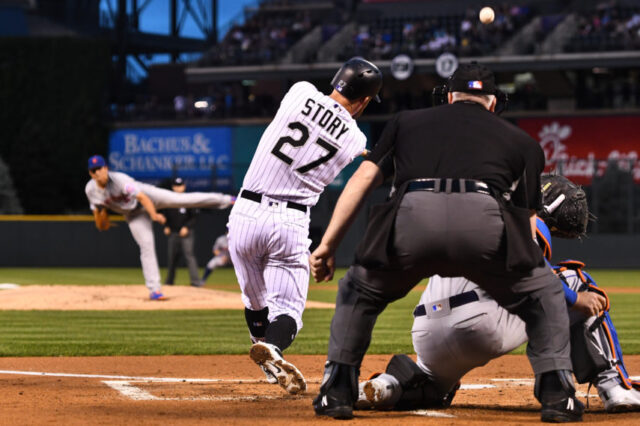 Colorado Rockies shortstop Trevor Story (27) RBI singles in the first inning against the New York Mets at Coors Field. Mandatory Credit: Ron Chenoy-USA TODAY Sports