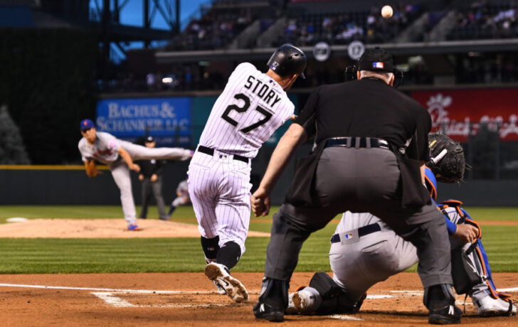 Colorado Rockies shortstop Trevor Story (27) RBI singles in the first inning against the New York Mets at Coors Field. Mandatory Credit: Ron Chenoy-USA TODAY Sports