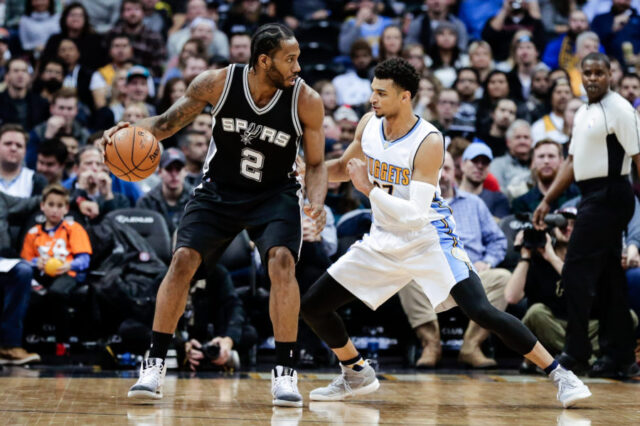 Denver Nuggets guard Jamal Murray (27) guards San Antonio Spurs forward Kawhi Leonard (2) in the fourth quarter at the Pepsi Center. The Spurs won 127-99.