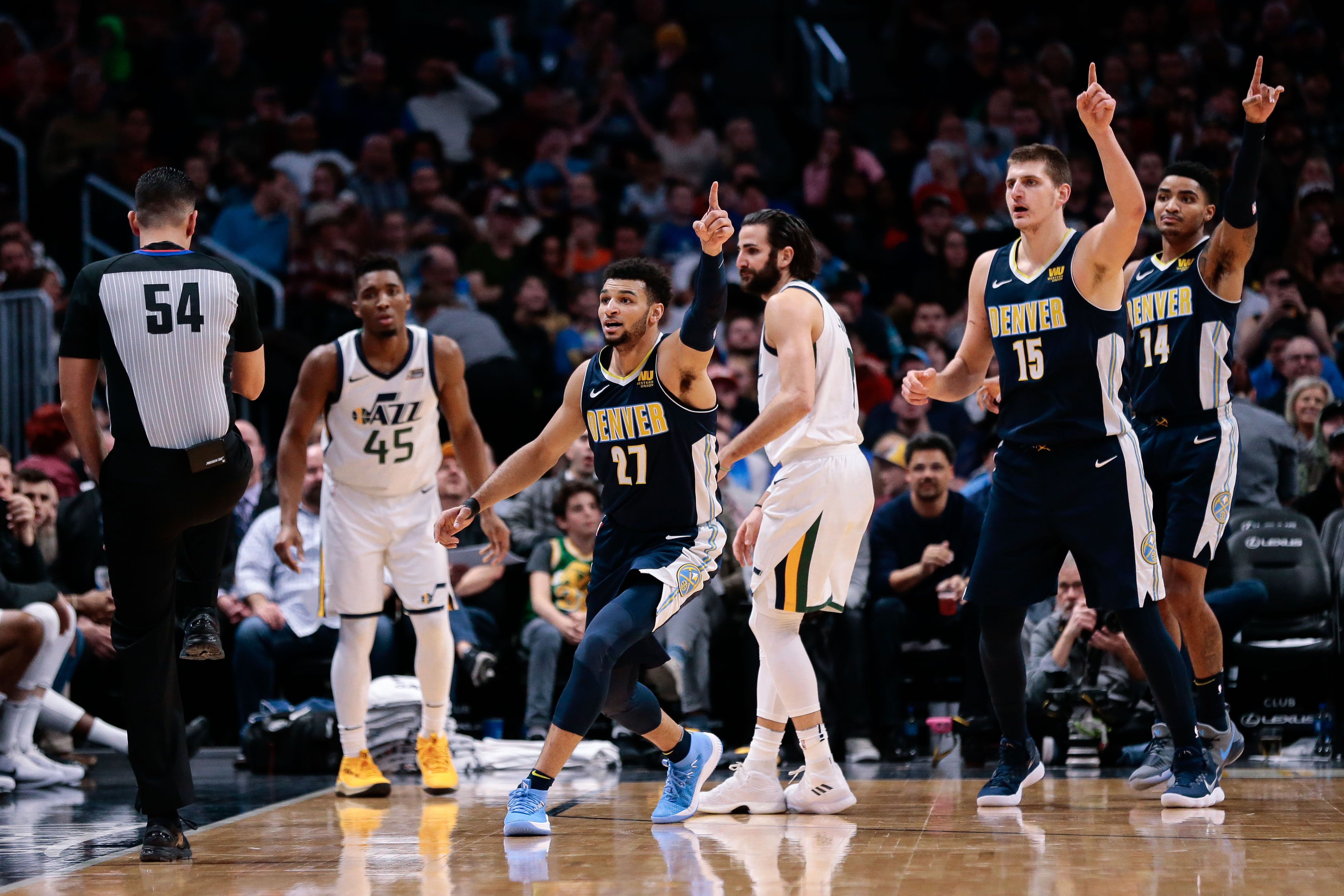 NBA: Utah Jazz at Denver Nuggets Utah Jazz guard Donovan Mitchell (45) and guard Ricky Rubio (3) look to referee Ray Acosta (54) as Denver Nuggets guard Jamal Murray (27) and center Nikola Jokic (15) and guard Gary Harris (14) motion in the third quarter at the Pepsi Center.