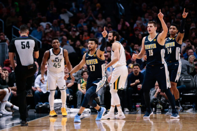 Utah Jazz guard Donovan Mitchell (45) and guard Ricky Rubio (3) look to referee Ray Acosta (54) as Denver Nuggets guard Jamal Murray (27) and center Nikola Jokic (15) and guard Gary Harris (14) motion in the third quarter at the Pepsi Center.