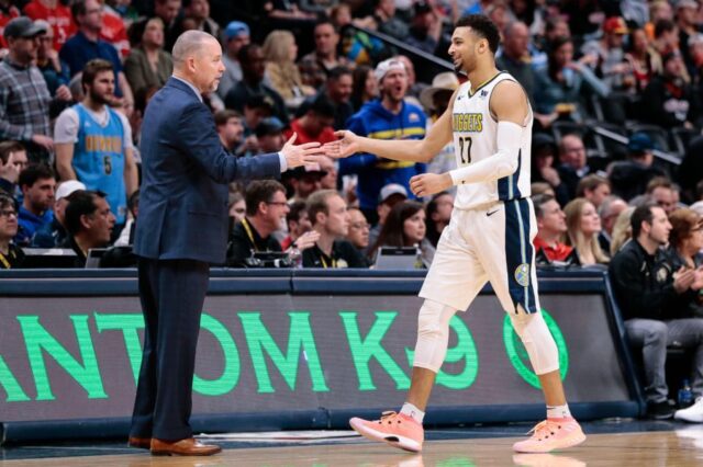 Denver Nuggets head coach Michael Malone and guard Jamal Murray (27) in the fourth quarter against the Houston Rockets at the Pepsi Center.