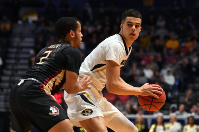 Missouri Tigers forward Michael Porter Jr. (13) controls the ball against Florida State Seminoles guard CJ Walker during the first half in the first round of the 2018 NCAA Tournament at Bridgestone Arena.