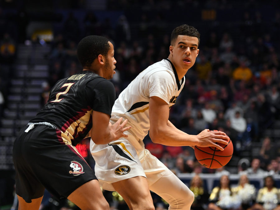 Missouri Tigers forward Michael Porter Jr. (13) controls the ball against Florida State Seminoles guard CJ Walker during the first half in the first round of the 2018 NCAA Tournament at Bridgestone Arena.