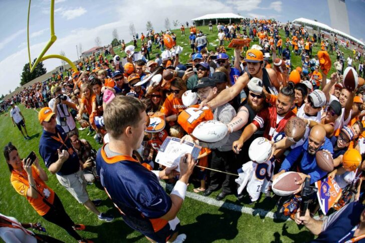 Denver Broncos quarterback Case Keenum (4) signs autographs after morning practice on the first day of training camp at UCHealth Training Center.