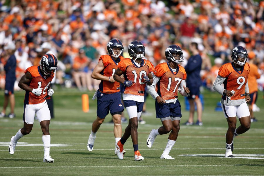Denver Broncos wide receivers Emmanuel Sanders (10) and Isaiah McKenzie (16) and River Cracraft (15) and DaeSean Hamilton (17) and John Diarse (9) during morning practice on the first day of training camp at UCHealth Training Center