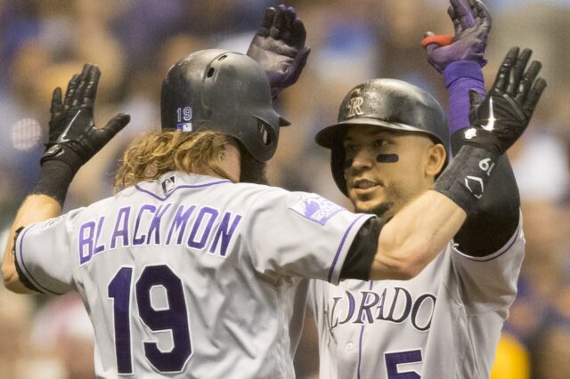 Carlos Gonzalez and Charlie Blackmon celebrate CarGo's homer in the sixth. Credit: Jeff Hanisch, USA TODAY Sports.