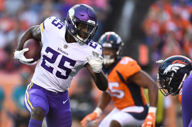 Latavius Murray running all over the Broncos defense. Credit: Ron Chenoy, USA TODAY Sports.