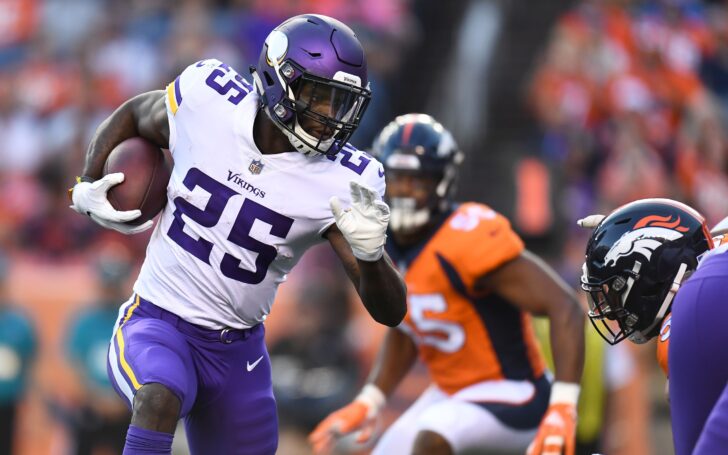 Latavius Murray running all over the Broncos defense. Credit: Ron Chenoy, USA TODAY Sports.