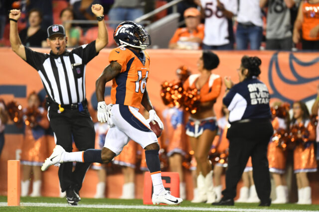 Denver Broncos wide receiver Isaiah McKenzie (16) returns a 78 yard punt return for a touchdown in the second against the Minnesota Vikings quarter at Broncos Stadium at Mile High.